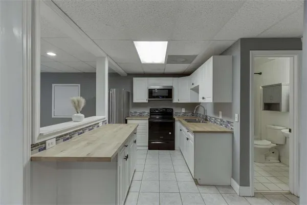 a house that has a tree in front of it