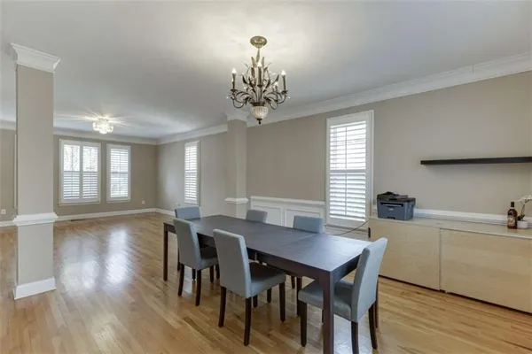 a view of a dining room with furniture window and wooden floor