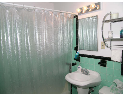 75 Strathmore Road, Unit 4 Boston, MA 02135 - Photo 5 of 13 a bathroom with a sink and a mirror
