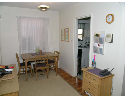 75 Strathmore Road, Unit 4 Boston, MA 02135 - Photo 8 of 13 a dining room with a table and chairs