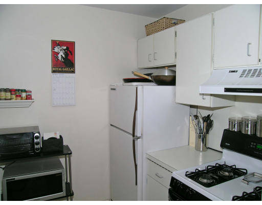 75 Strathmore Road, Unit 4 Boston, MA 02135 - Photo 10 of 13 a kitchen with stainless steel appliances granite countertop a refrigerator and a stove