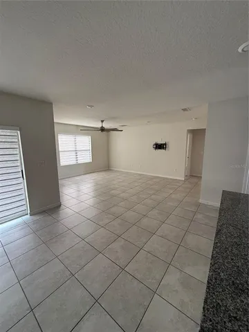 a kitchen with stainless steel appliances a refrigerator sink stove microwave and cabinets