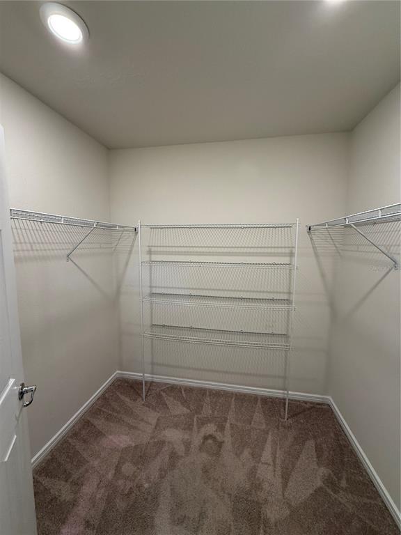 619 Citrus Isle Boulevard Davenport, FL 33837 - Photo 19 of 21 a view of a room with empty racks