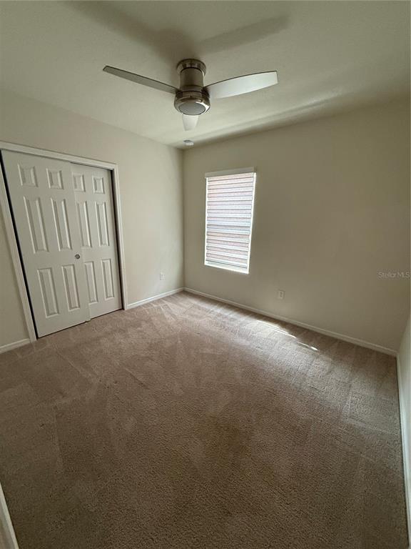 619 Citrus Isle Boulevard Davenport, FL 33837 - Photo 10 of 21 a view of an empty room with a window