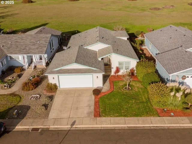 an aerial view of a house with a ocean view