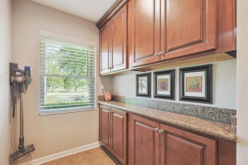 635 Old Justin Road Argyle, TX 76226 - Photo 11 of 36 a kitchen with stainless steel appliances granite countertop a sink and a window