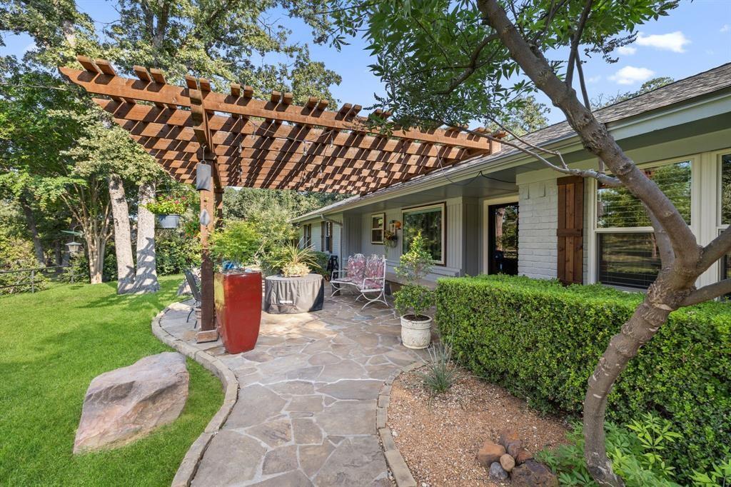 635 Old Justin Road Argyle, TX 76226 - Photo 22 of 36 a view of a house with backyard sitting area and garden