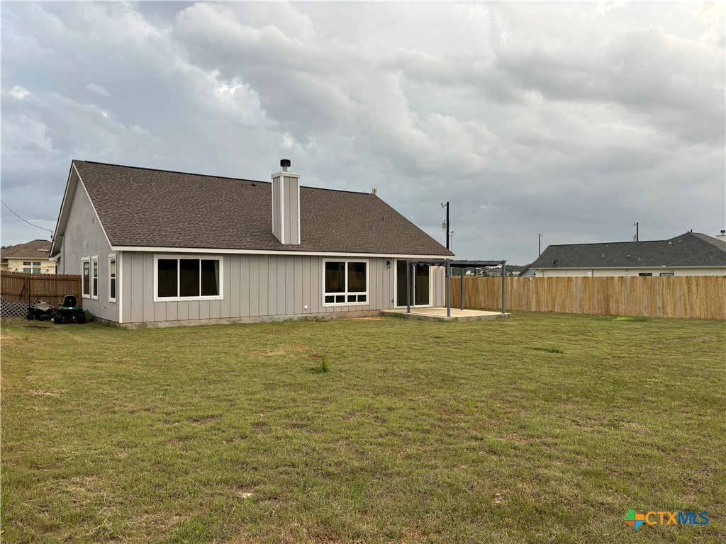 110 Hiram Cook Blanco, TX 78606 - Photo 5 of 46 a front view of a house with a yard