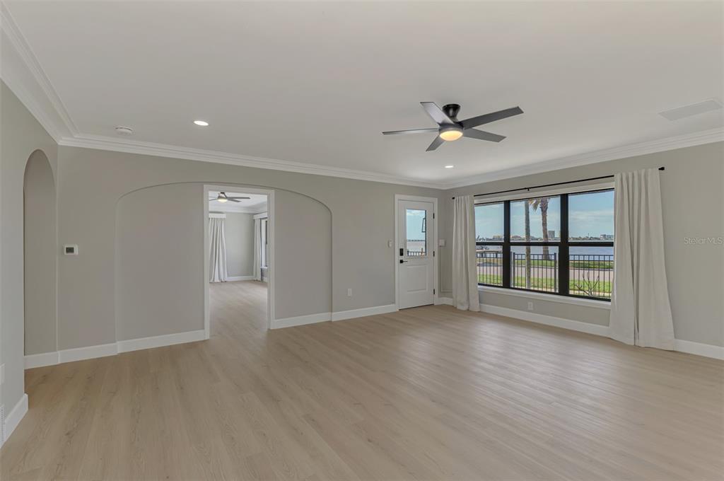 1822 Riverside Drive East Bradenton, FL 34208 - Photo 17 of 46 a view of an empty room with a window and wooden floor