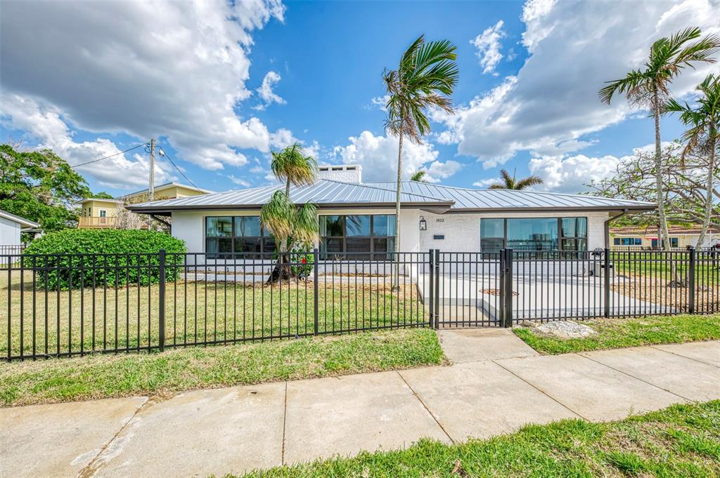 1822 Riverside Drive East Bradenton, FL 34208 - Photo 2 of 46 a front view of a house with a garden and plants