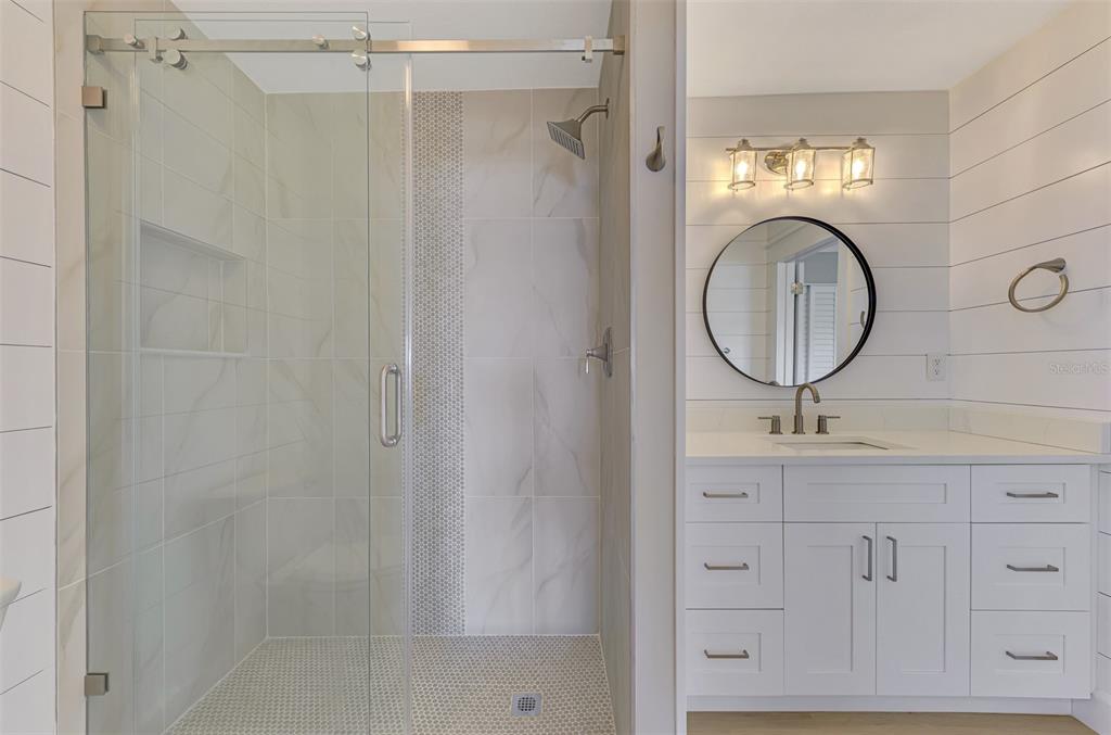 1822 Riverside Drive East Bradenton, FL 34208 - Photo 22 of 46 a bathroom with a sink a toilet and a mirror