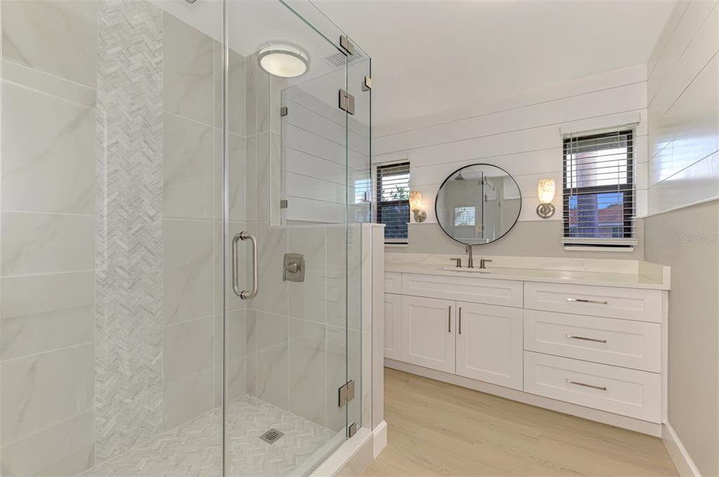 1822 Riverside Drive East Bradenton, FL 34208 - Photo 29 of 46 a bathroom with a mirror a sink and a mirror