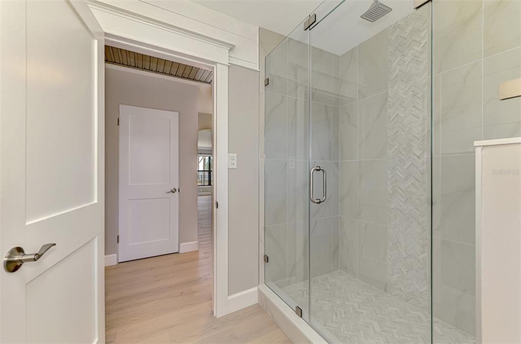 1822 Riverside Drive East Bradenton, FL 34208 - Photo 30 of 46 a bathroom with a shower and a glass door