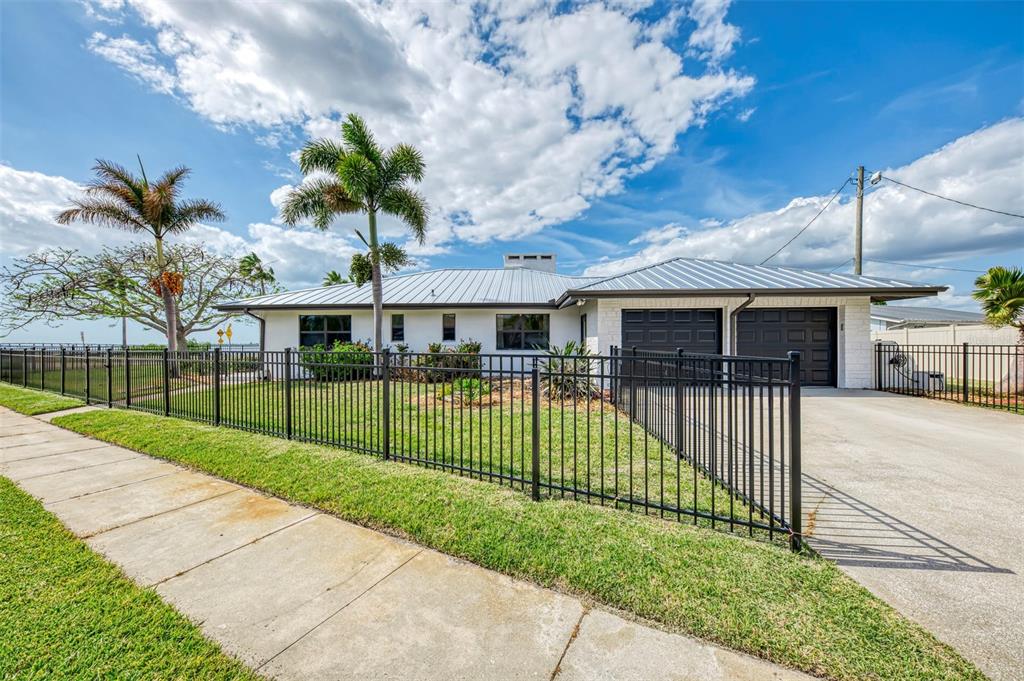 1822 Riverside Drive East Bradenton, FL 34208 - Photo 3 of 46 a view of a house with a yard