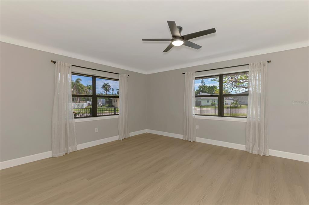 1822 Riverside Drive East Bradenton, FL 34208 - Photo 33 of 46 a view of a livingroom with a ceiling fan and window