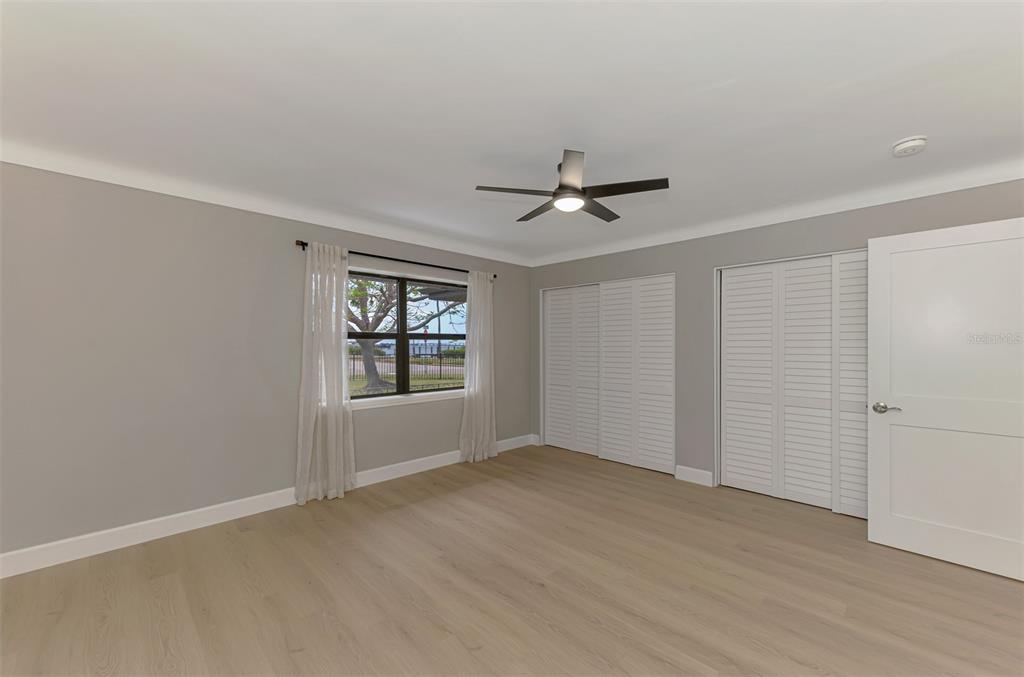 1822 Riverside Drive East Bradenton, FL 34208 - Photo 34 of 46 wooden floor in an empty room with a window