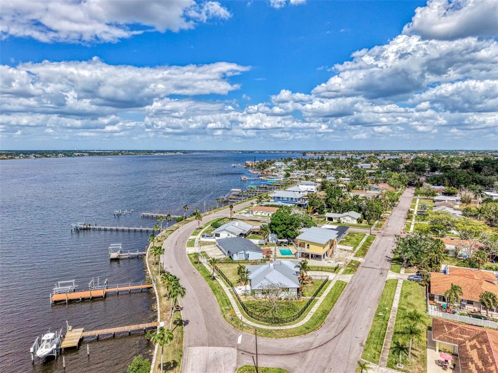 1822 Riverside Drive East Bradenton, FL 34208 - Photo 42 of 46 an aerial view of a swimming pool with outdoor seating