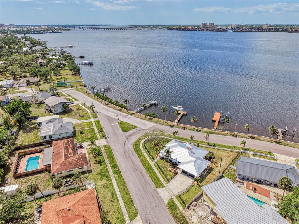 1822 Riverside Drive East Bradenton, FL 34208 - Photo 45 of 46 an aerial view of a house with a garden and lake view