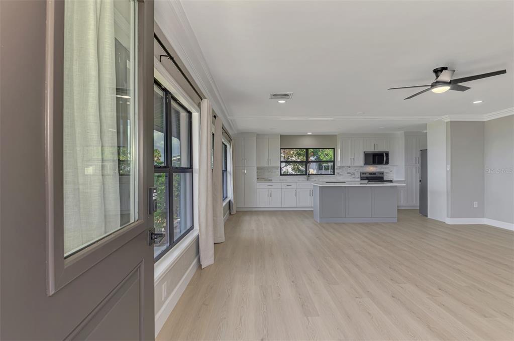 1822 Riverside Drive East Bradenton, FL 34208 - Photo 8 of 46 a view of a kitchen with wooden floor and a kitchen