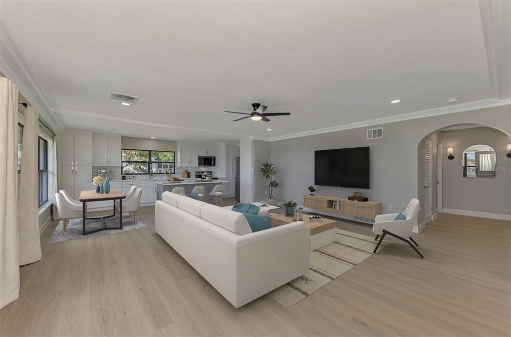 1822 Riverside Drive East Bradenton, FL 34208 - Photo 9 of 46 a living room with furniture and a flat screen tv
