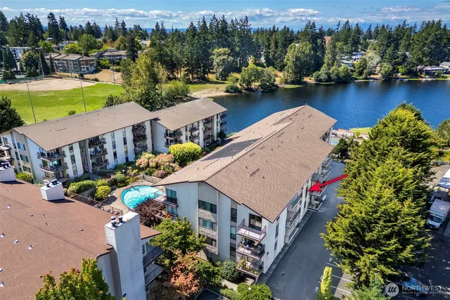 an aerial view of a house with a lake view