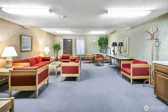 an aerial view of a house a yard and mountain view