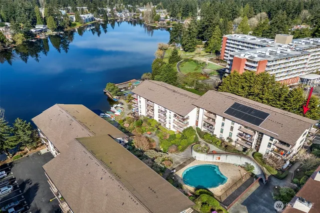 an aerial view of a house with a yard and potted plants