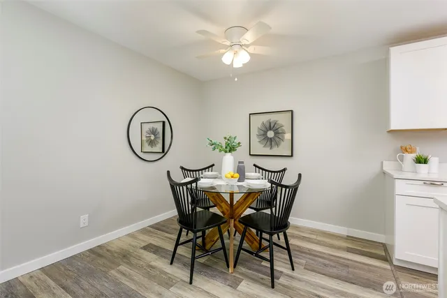 a view of a dining room with furniture and a chandelier