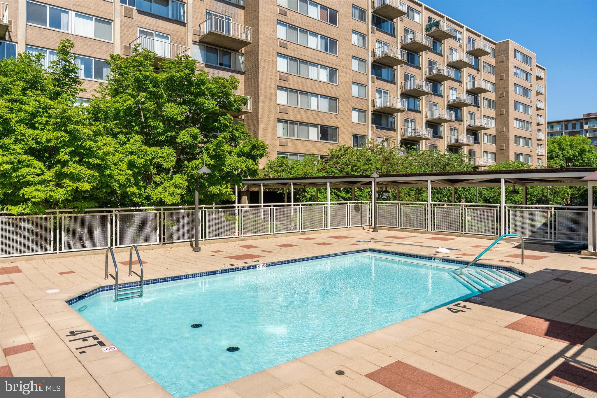 800 4th Street Southwest, Unit N501 Washington, DC 20024 - Photo 16 of 16 a view of a swimming pool with a lounge chair