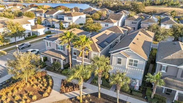 an aerial view of residential houses with outdoor space