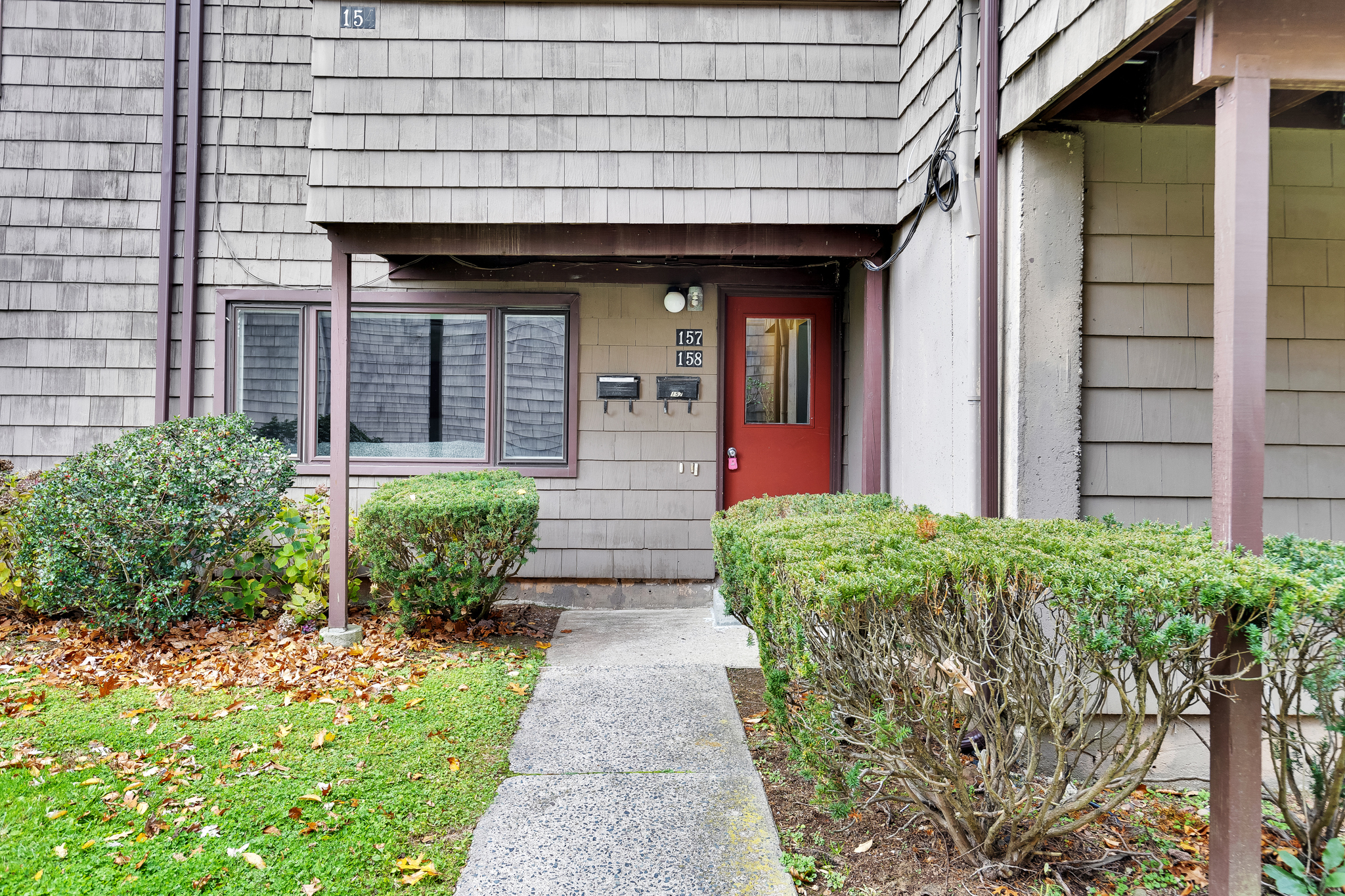a front view of a house with garden