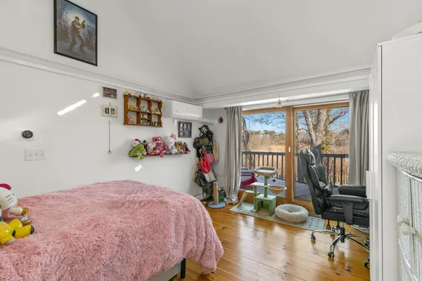 a view of living room filled with furniture and flat screen tv