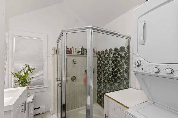 a living room with granite countertop furniture and a flat screen tv