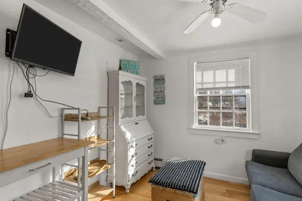 a bedroom with furniture and a window