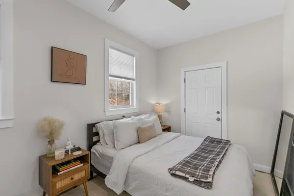 a kitchen with granite countertop white cabinets and sink