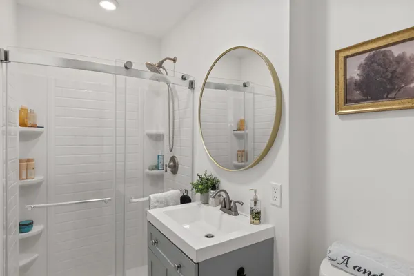 a bedroom with a bed and a window with outer view