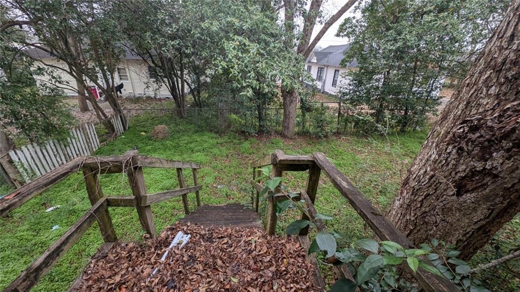 3855 Mercer Street Macon, GA 31204 - Photo 14 of 14 a view of a garden with a bench