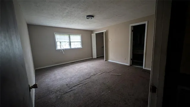 a view of empty room with windows