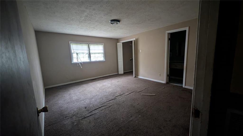 3855 Mercer Street Macon, GA 31204 - Photo 3 of 14 a view of empty room with windows
