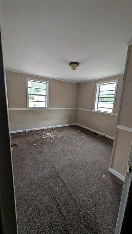 3855 Mercer Street Macon, GA 31204 - Photo 4 of 14 an empty room with windows