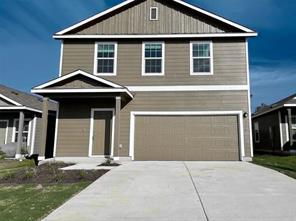 a front view of a house with yard