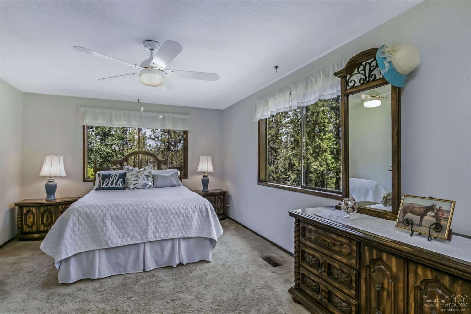 19435 Dayton Road Bend, OR 97703 - Photo 10 of 25 a bedroom with a bed and a dresser