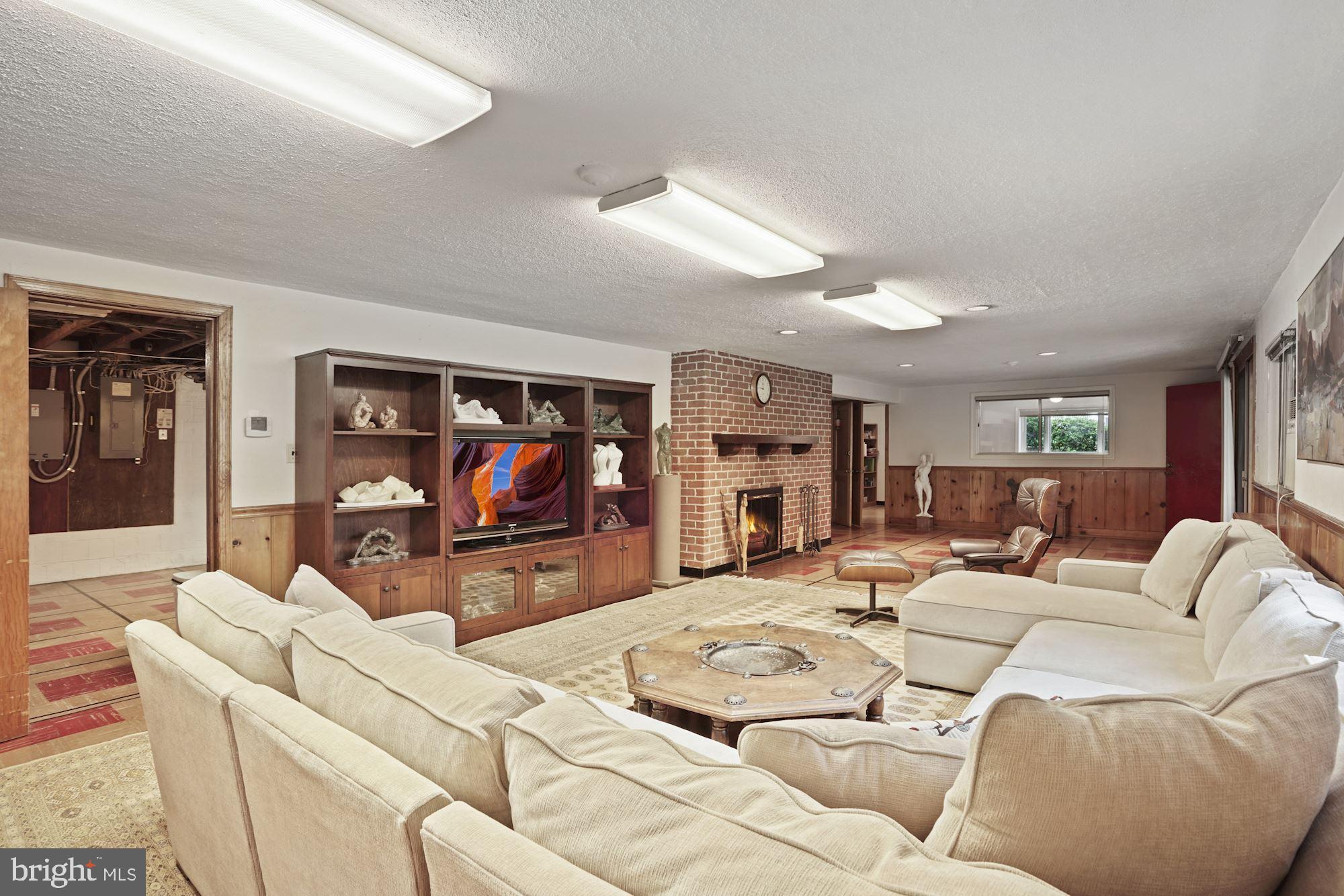 3305 Winnett Road Chevy Chase, MD 20815 - Photo 22 of 44 Rec room with wood burning fireplace
