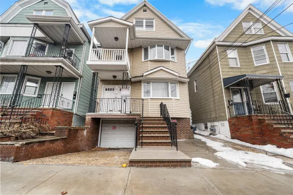 a front view of a house with a garage