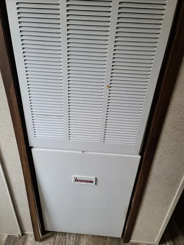 a view of a hallway and a window