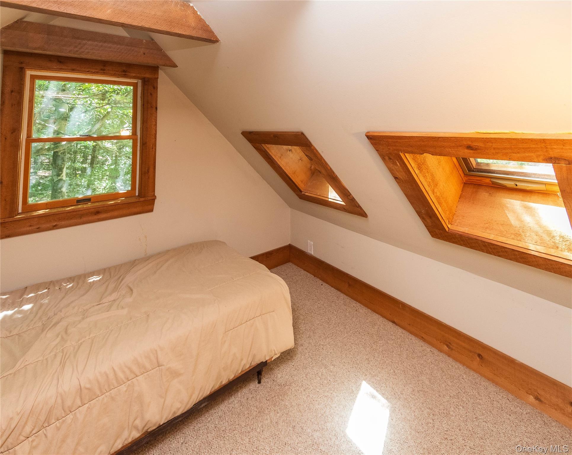 885 Grandview Road Hancock, NY 13783 - Photo 22 of 49 a bedroom with a bed and window