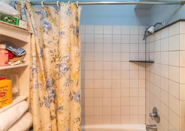 a kitchen with a window and cabinets