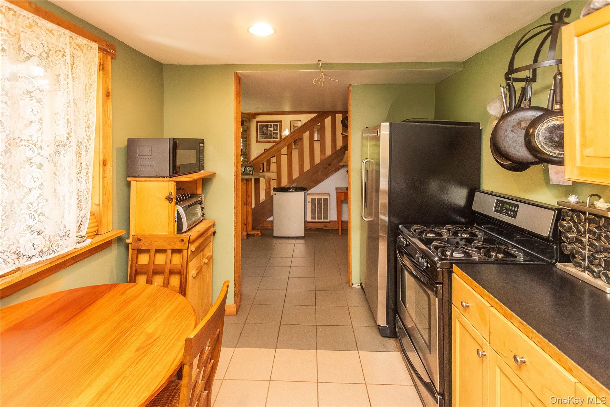 885 Grandview Road Hancock, NY 13783 - Photo 29 of 49 a kitchen with stainless steel appliances granite countertop a stove and a refrigerator