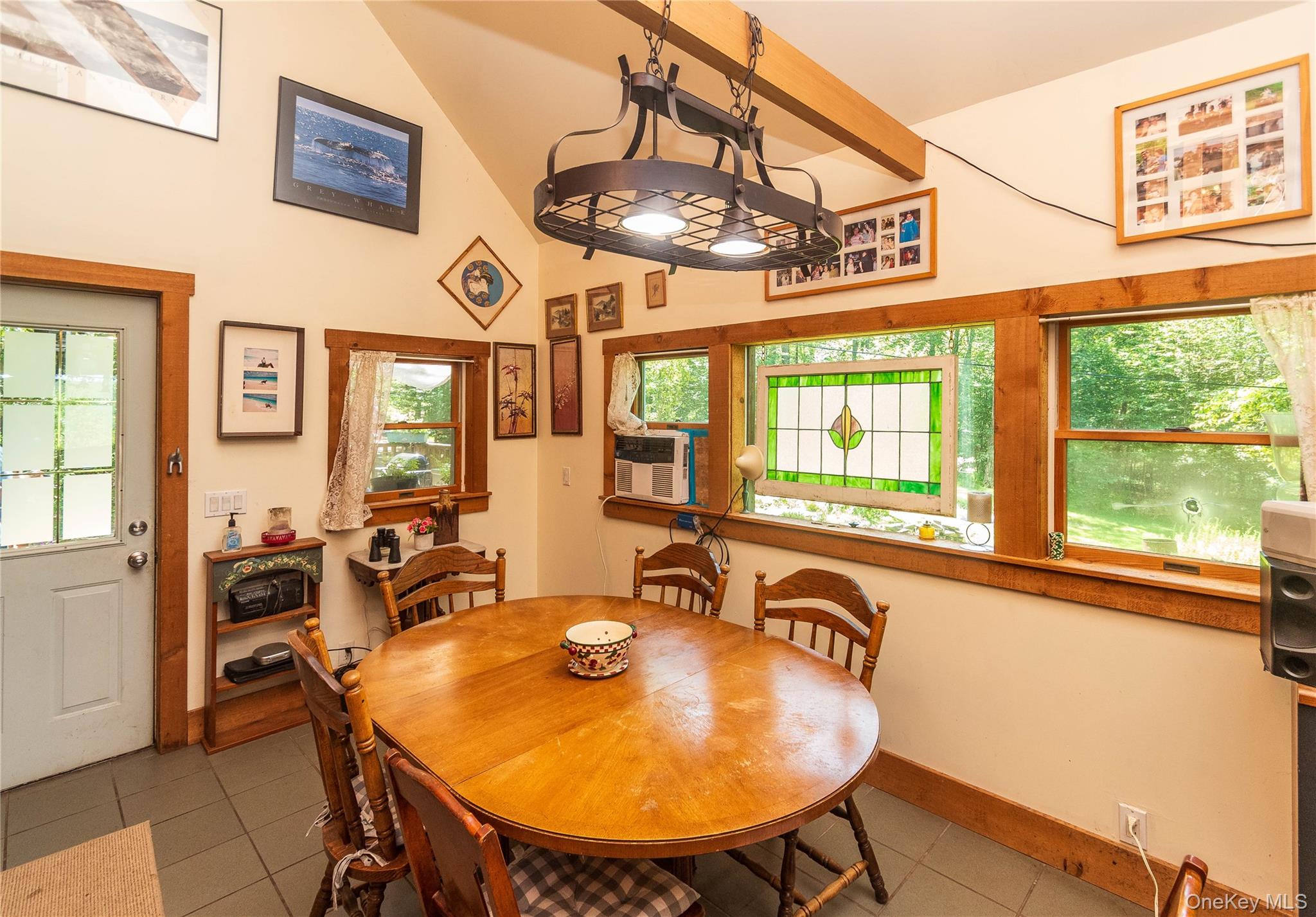 885 Grandview Road Hancock, NY 13783 - Photo 33 of 49 a view of a dining room with furniture a chandelier and wooden floor