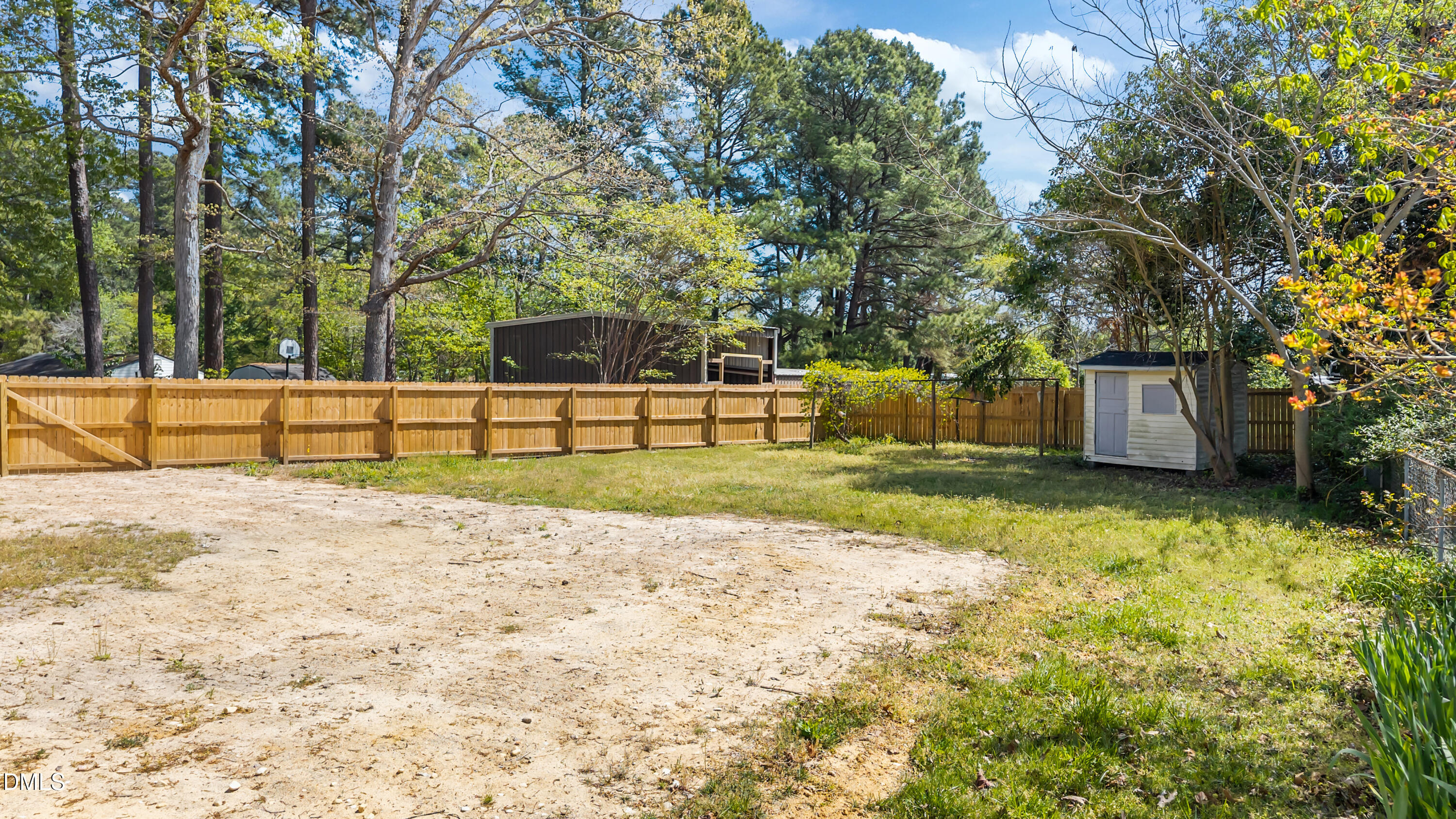 4149 Woodcrest Road Rocky Mount, NC 27803 - Photo 13 of 43 a view of a backyard with large trees